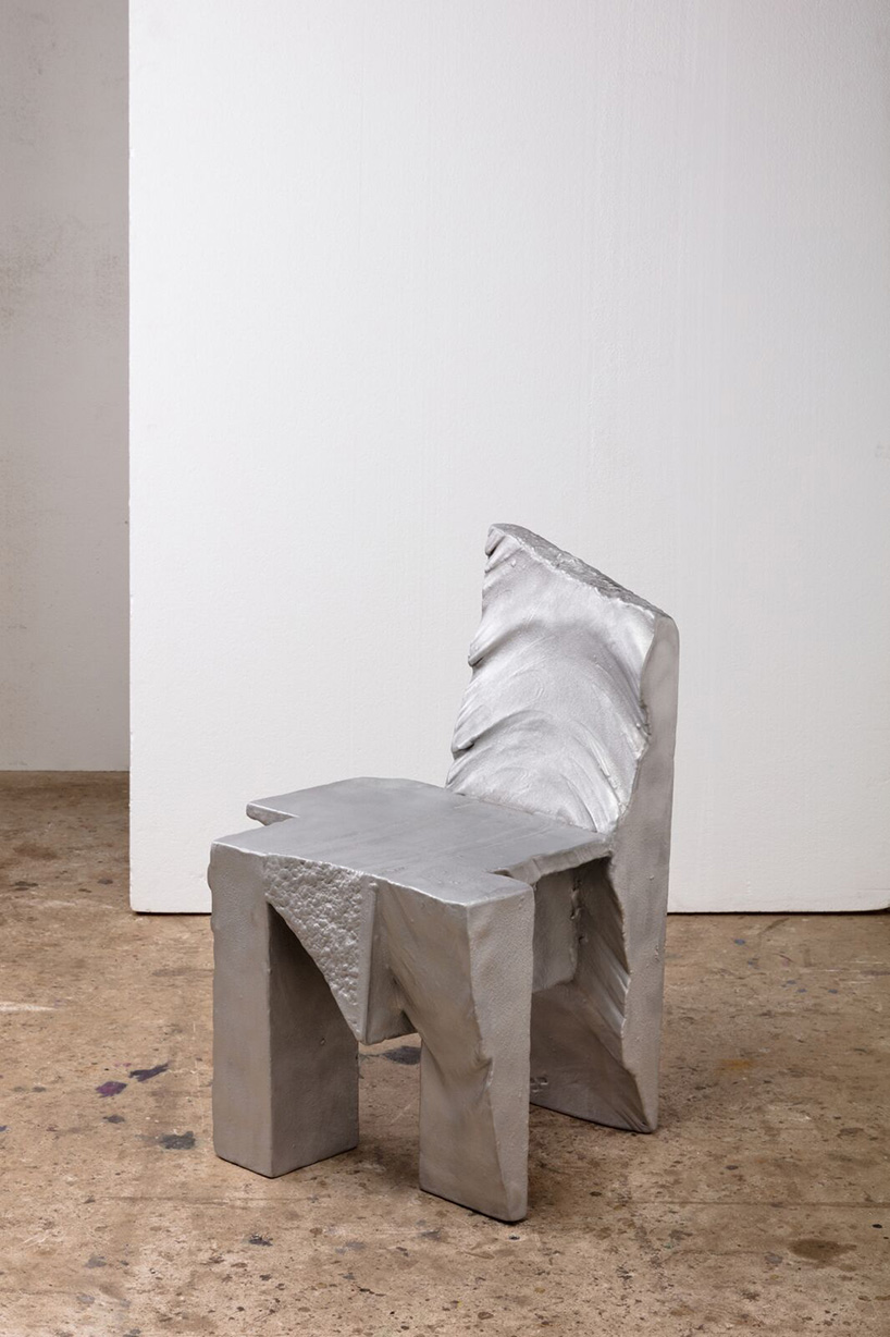 max lamb carves ‘prehistoric' objects from polystyrene then coats them with aluminum paint