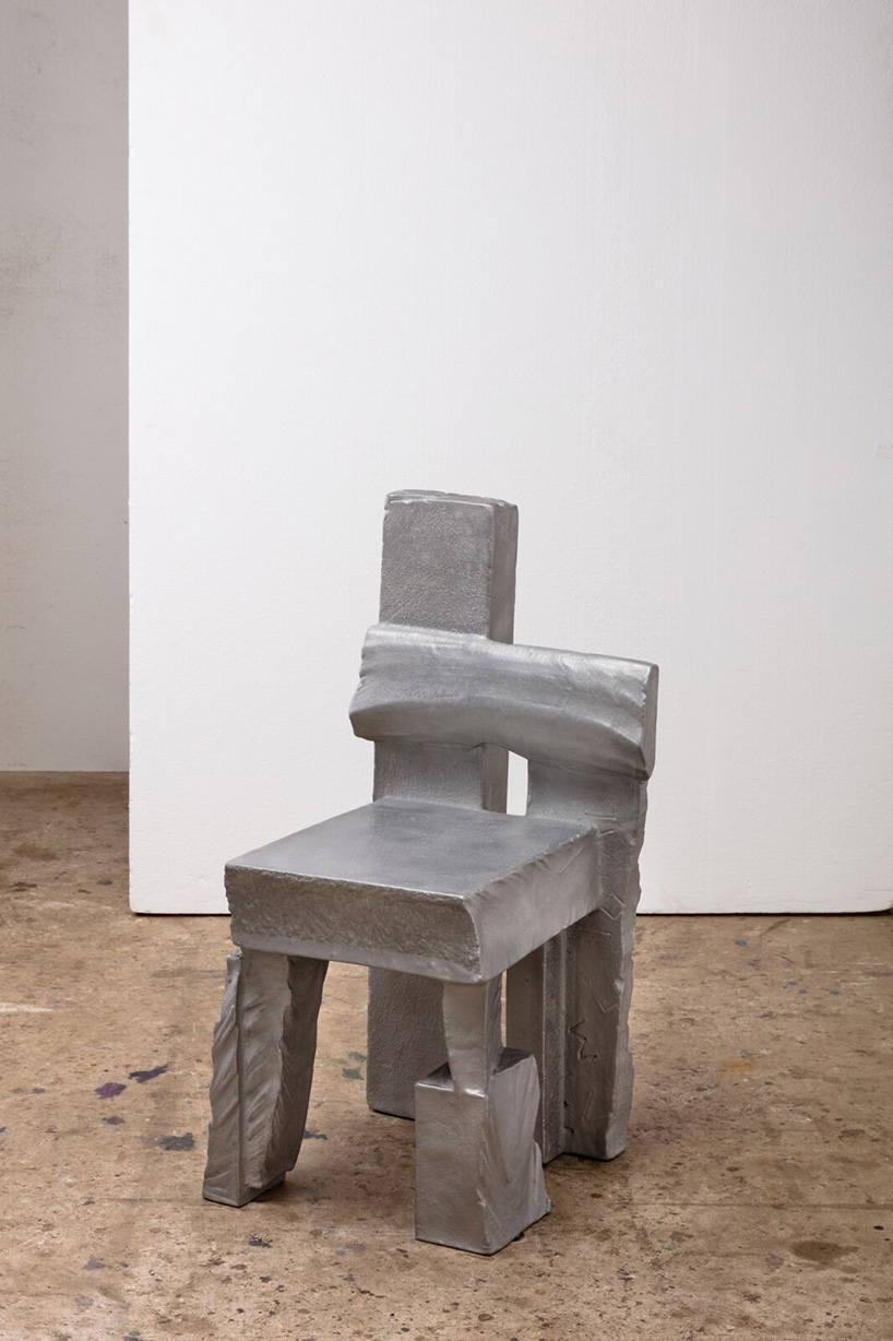 max lamb carves ‘prehistoric' objects from polystyrene then coats them with aluminum paint