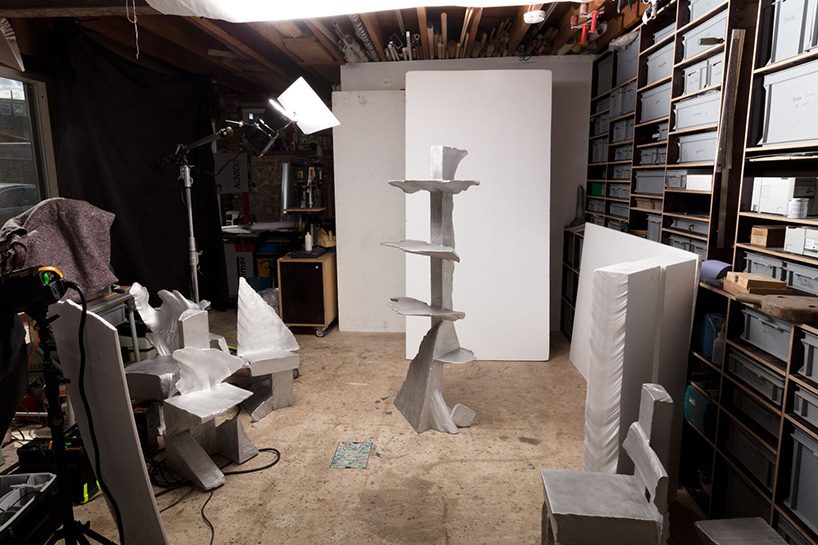 max lamb carves ‘prehistoric' objects from polystyrene then coats them with aluminum paint