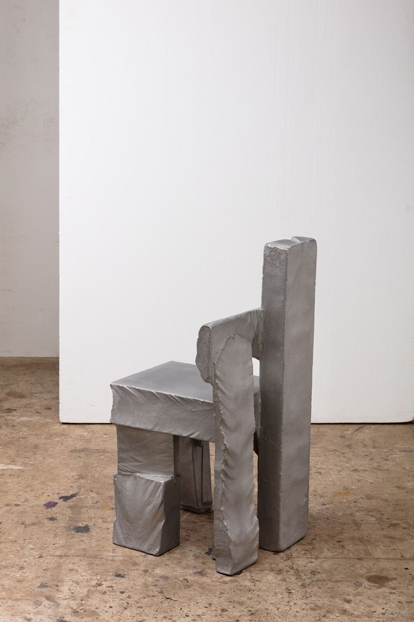 max lamb carves ‘prehistoric' objects from polystyrene then coats them with aluminum paint