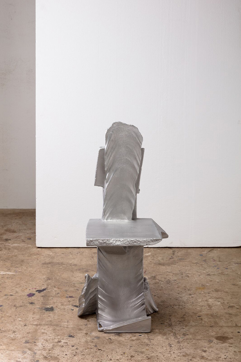 max lamb carves ‘prehistoric' objects from polystyrene then coats them with aluminum paint