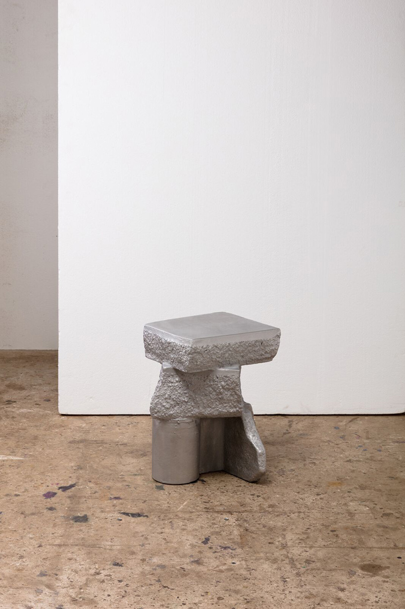 max lamb carves ‘prehistoric' objects from polystyrene then coats them with aluminum paint
