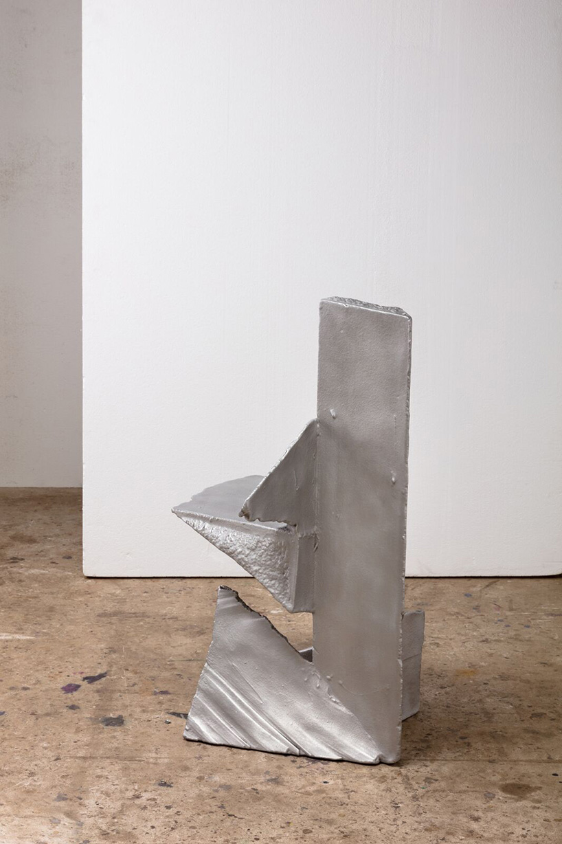 max lamb carves ‘prehistoric' objects from polystyrene then coats them with aluminum paint