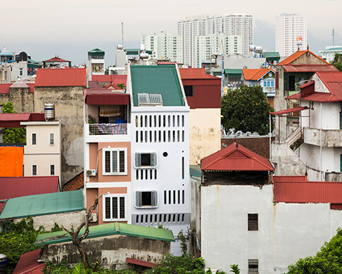 moon house by nh village in vietnam stands out from the surroundings with its futuristic façade