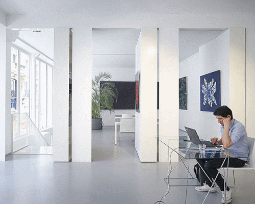 pivoting bookshelves turn this office in paris into a gallery, by hugoo and brillet