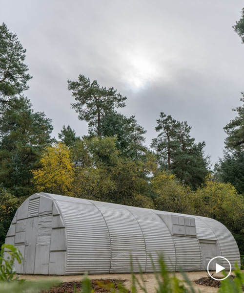 artist rachel whiteread sculpts cast concrete version of a nissen hut in UK forest