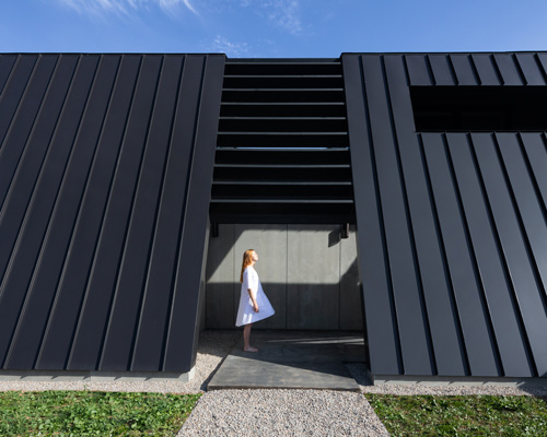 omar gandhi protects coastal home in nova scotia with 'mysterious' steel façade