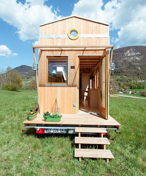 optinid's tiny house features a sliding roof that opens to the sky