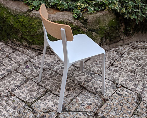 ruelle chair by philippe tabet combines cast alumnum with plywood