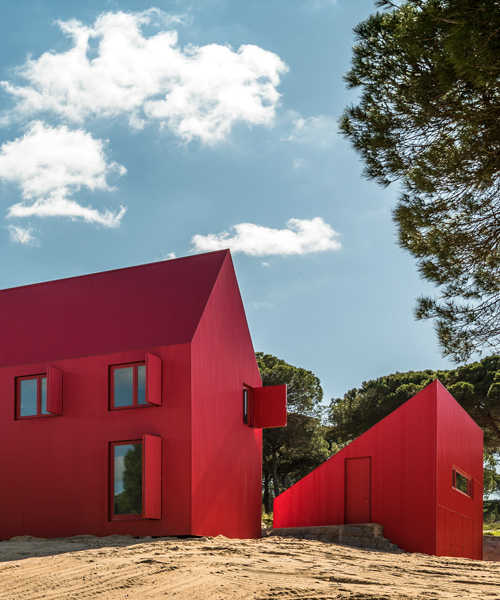 this bright red house in portugal has been designed to stand out