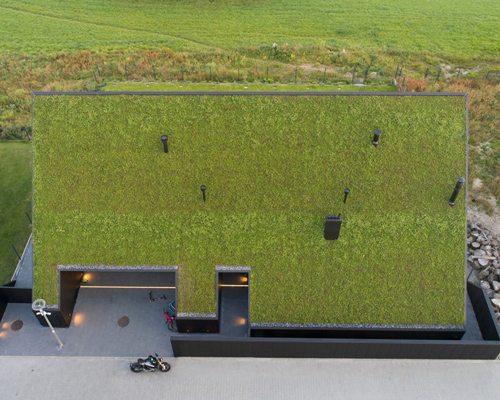 superhelix studio increases site's green space with 'house behind the roof'