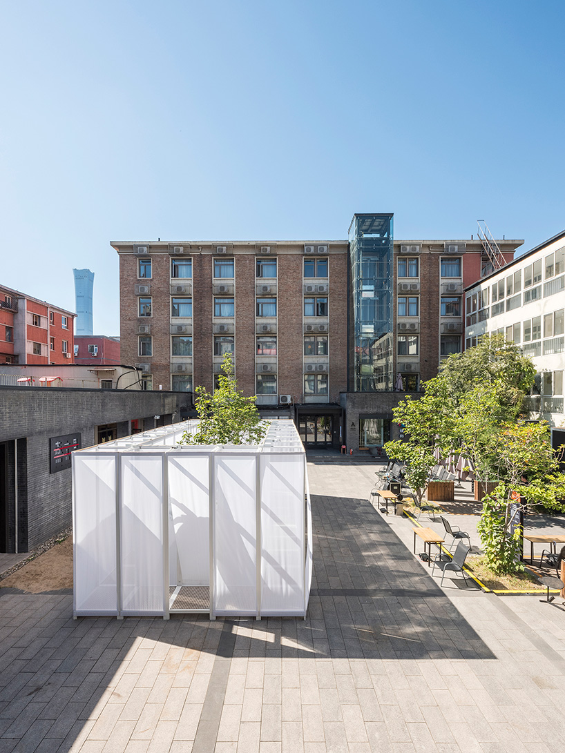 superimpose wraps beijing's CO2 pavilion in translucent screens and smoke