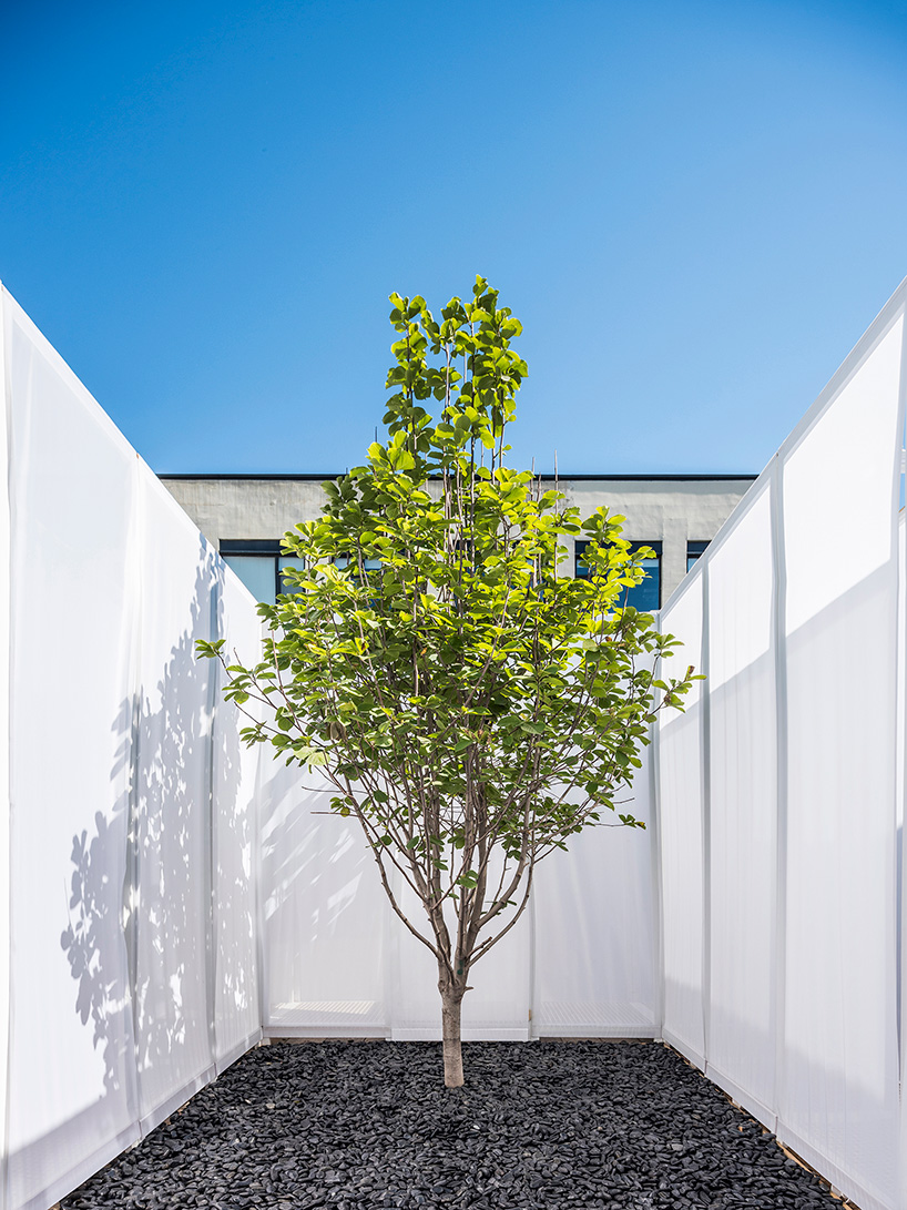 superimpose wraps beijing's CO2 pavilion in translucent screens and smoke