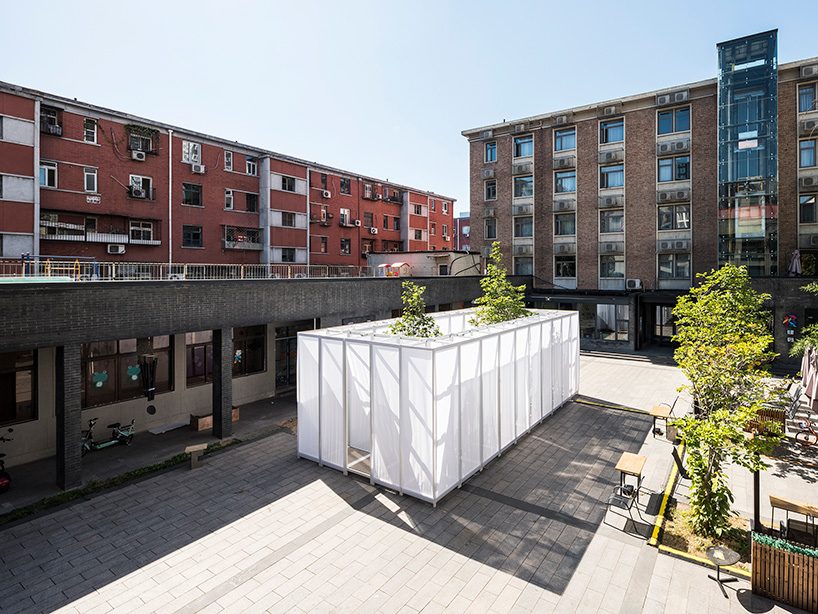 superimpose wraps beijing's CO2 pavilion in translucent screens and smoke
