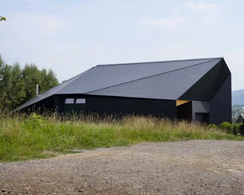 black rock house by MUS architects derives from topography of polish mountains
