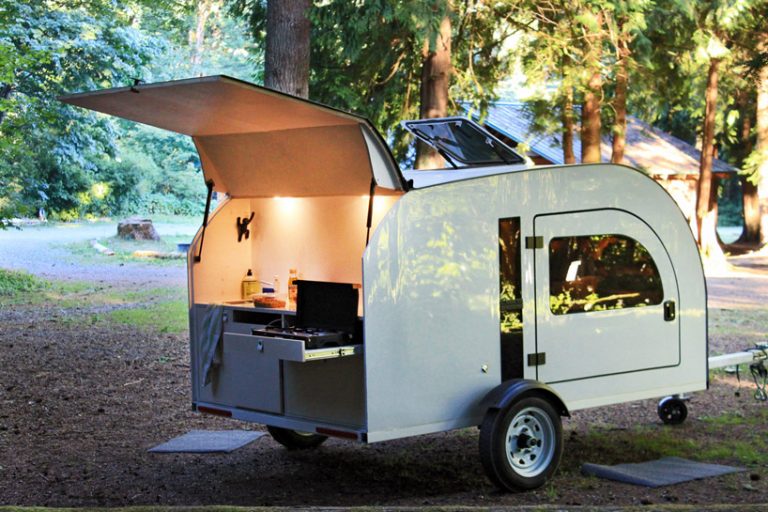 this tiny teardrop trailer fits a queen size bed and fully equipped kitchen