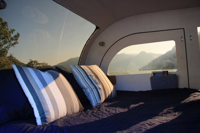 this tiny teardrop trailer fits a queen size bed and fully equipped kitchen droplet