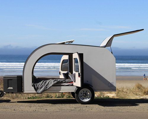 this tiny teardrop trailer fits a queen size bed and fully equipped kitchen