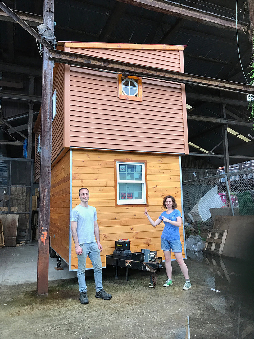 this tiny house on wheels has a raising roof that reveals a second floor