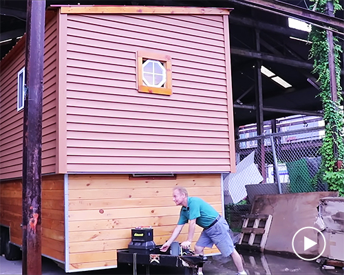 this tiny house on wheels has a raising roof that reveals a second floor