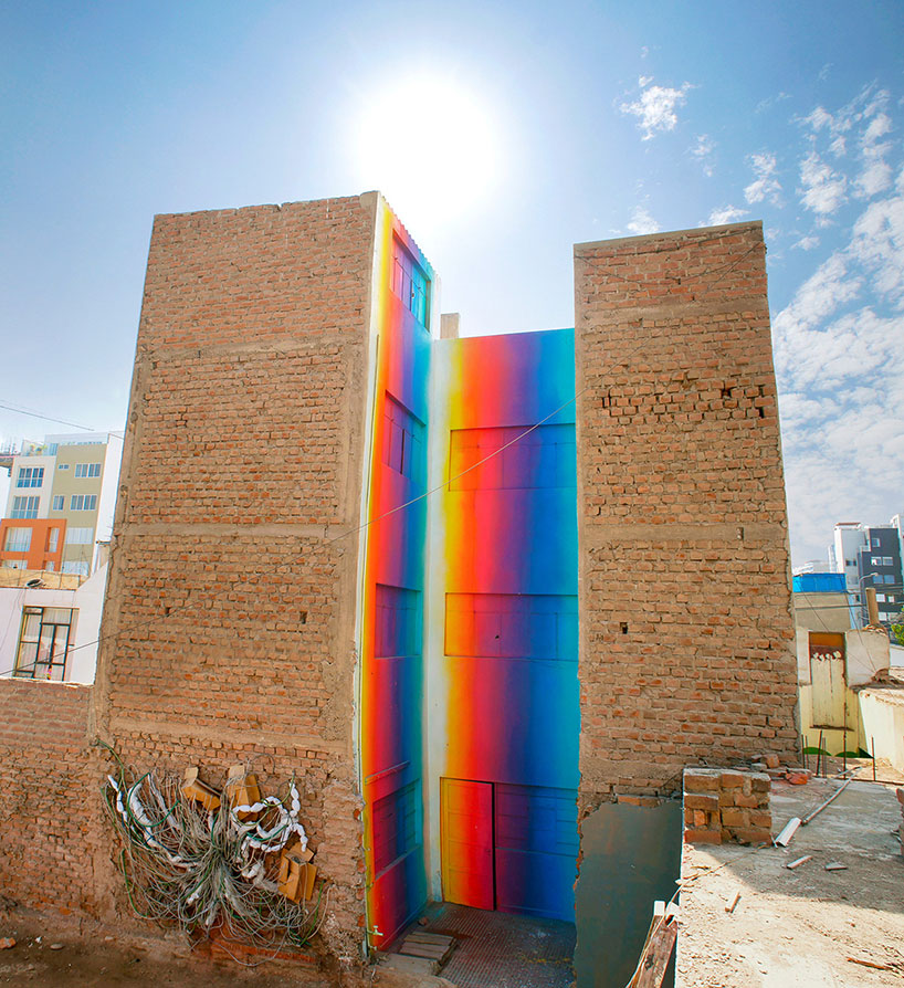 this building in lima is bathed in a spectrum of colorful hues