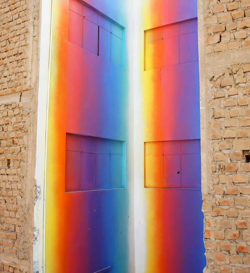 this building in lima is bathed in a spectrum of colorful hues