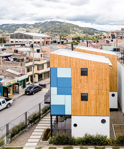 cubic houses in paipa, colombia, attract attention by colors and materiality