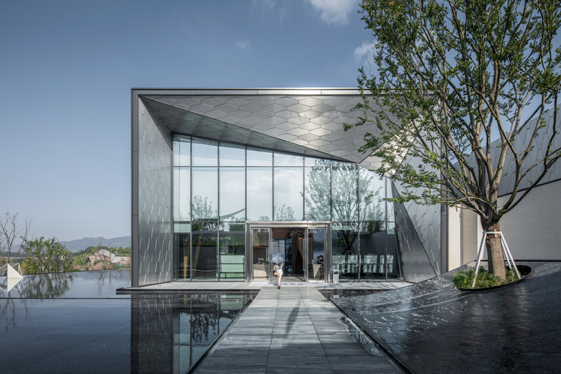 'digital' skin clads undulating timber structure in china community center