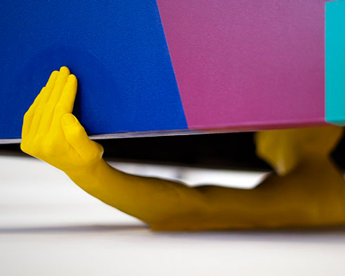 this coffee table by V & KO is supported by bust sculpture