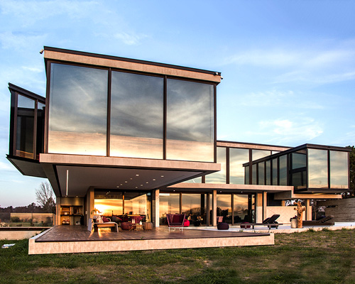 g2 estudio's dragonfly house is built with all-glass facades for 360º views over buenos aires