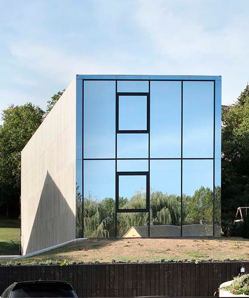 single-family house by 2001 juts like a concrete monolith from the ground