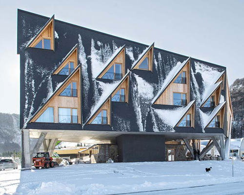 this hotel features dormer windows that mimic northern italy's mountainous landscape