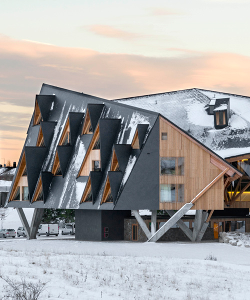 this hotel features dormer windows that mimic northern italy's mountainous landscape