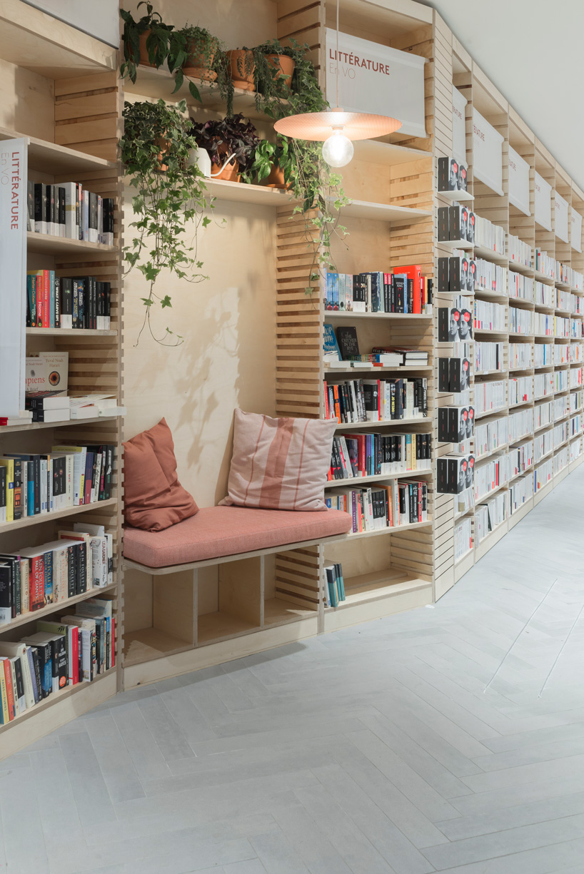 studio briand & berthereau combines terracotta, raw concrete + wood in parisian bookstore