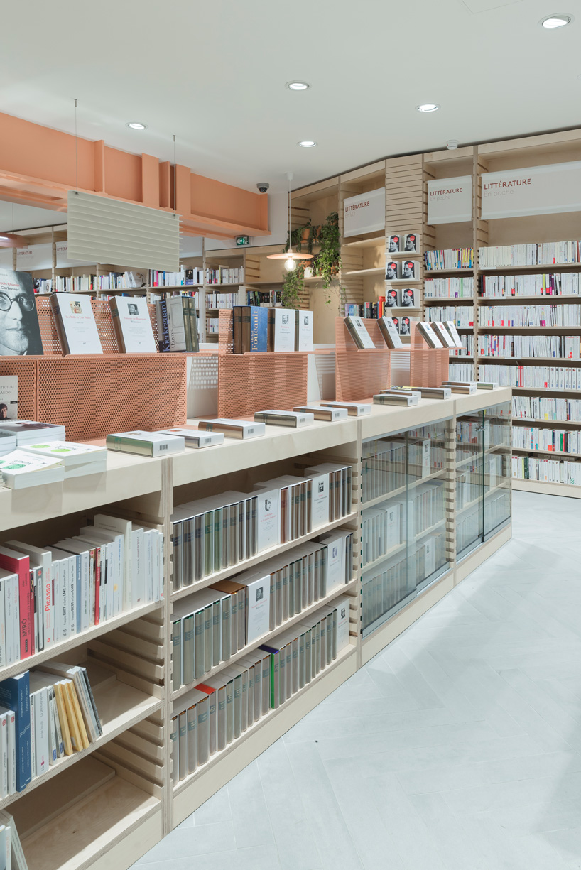 studio briand & berthereau combines terracotta, raw concrete + wood in parisian bookstore
