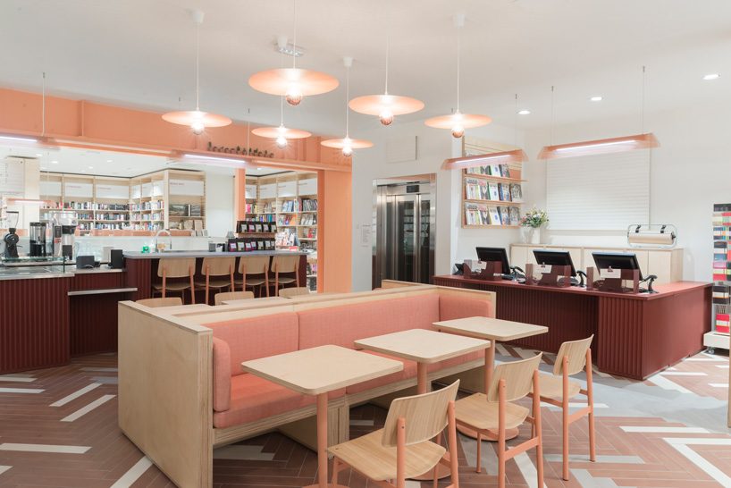 studio briand & berthereau combines terracotta, raw concrete + wood in parisian bookstore