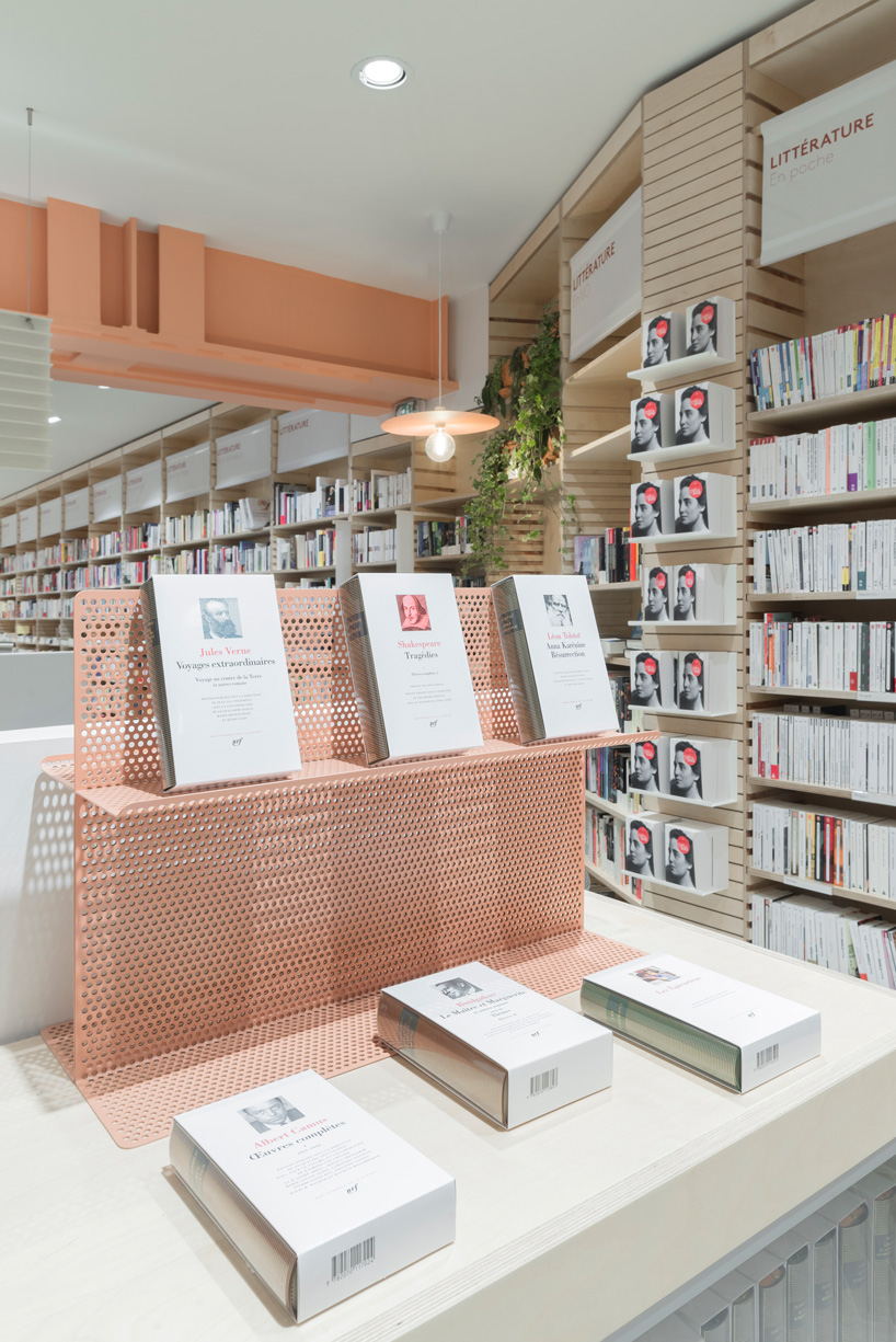 studio briand & berthereau combines terracotta, raw concrete + wood in parisian bookstore
