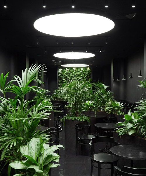 KOSMOS builds a black calm island for airport lounge in russia