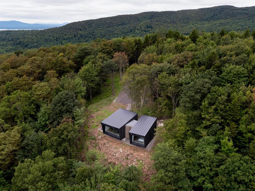  naturehumaine's la binocle cabin comprises two angular volumes clad in burnt wood