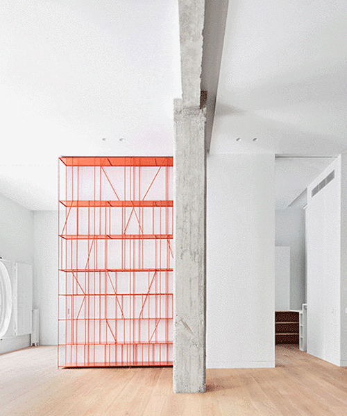 lucas y hernández-gil completes a madrid apartment with a coral-painted metal shelf