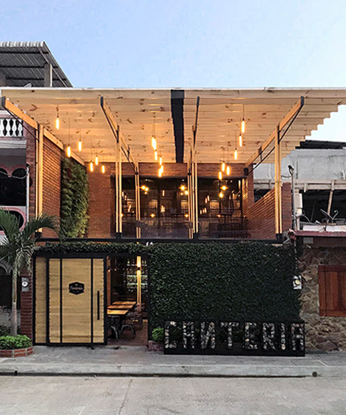 red brick and vertical gardens define 'canteria' restaurant design in ecuador