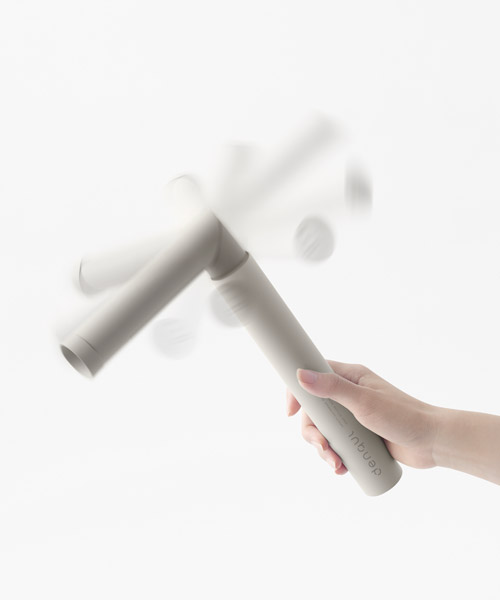 nendo designs mobile battery that is charged by hand using a swinging motion