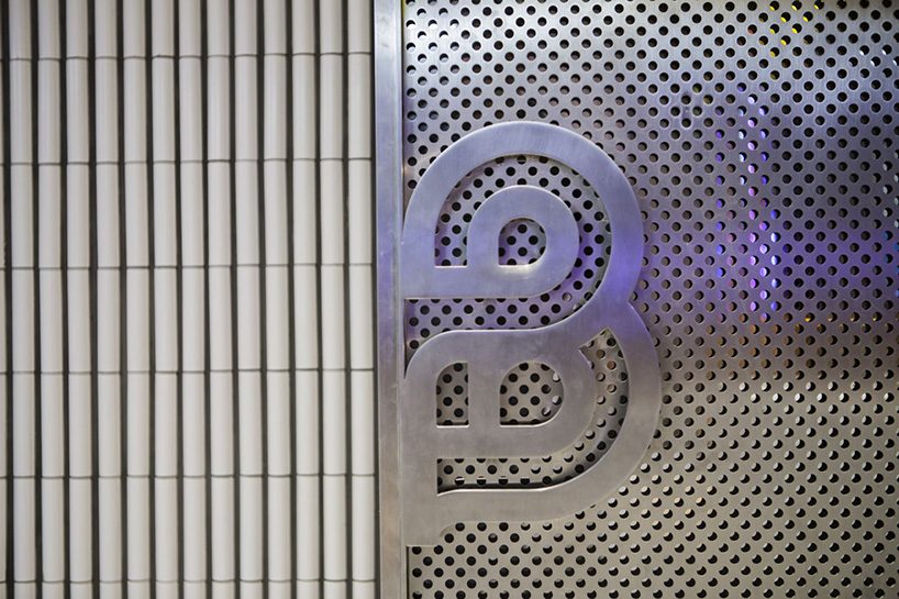 neri & hu incorporates reflective stainless steel and neon in shanghai's little B concept store