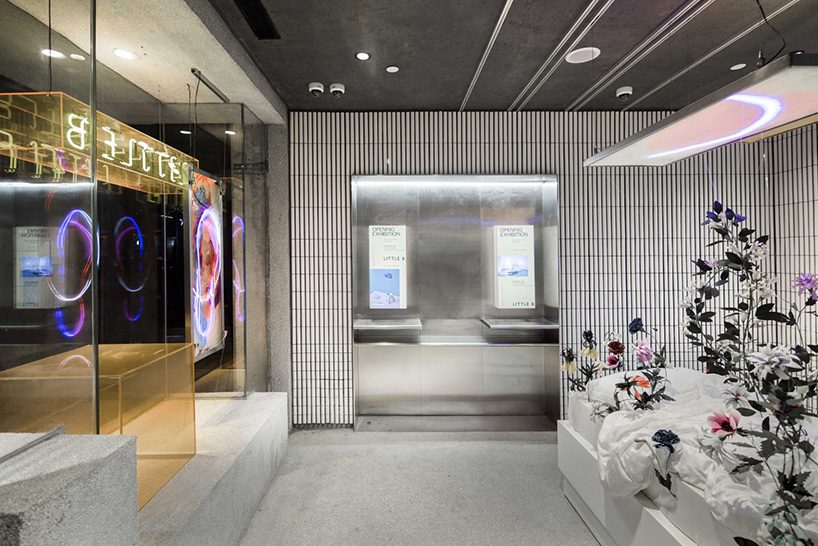 neri & hu incorporates reflective stainless steel and neon in shanghai's little b concept store