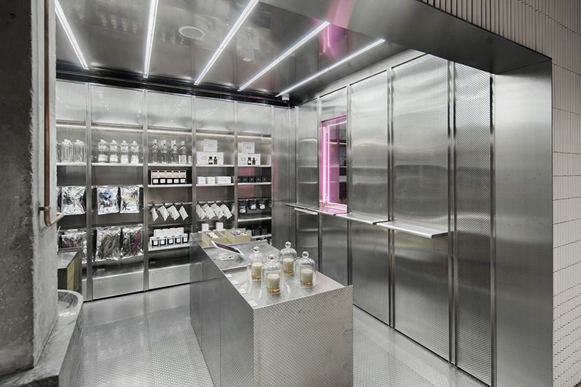 neri & hu incorporates reflective stainless steel and neon in shanghai's little b concept store