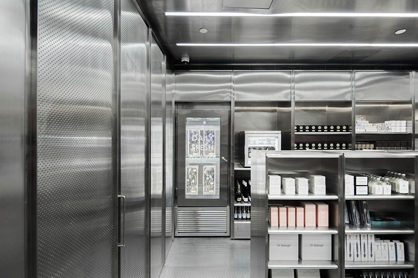 neri & hu incorporates reflective stainless steel and neon in shanghai's little B concept store