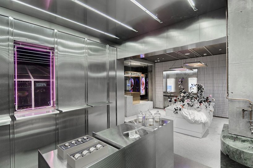 neri & hu incorporates reflective stainless steel and neon in shanghai's little B concept store