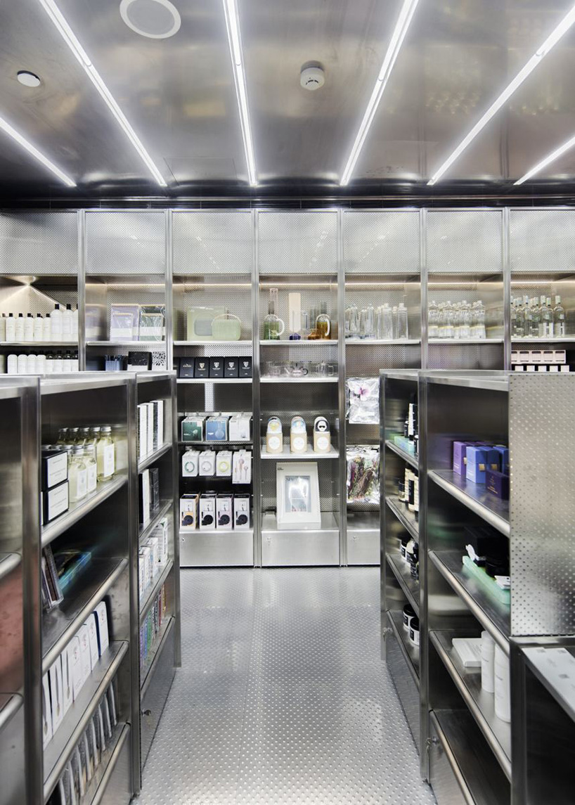 neri & hu incorporates reflective stainless steel and neon in shanghai's little B concept store