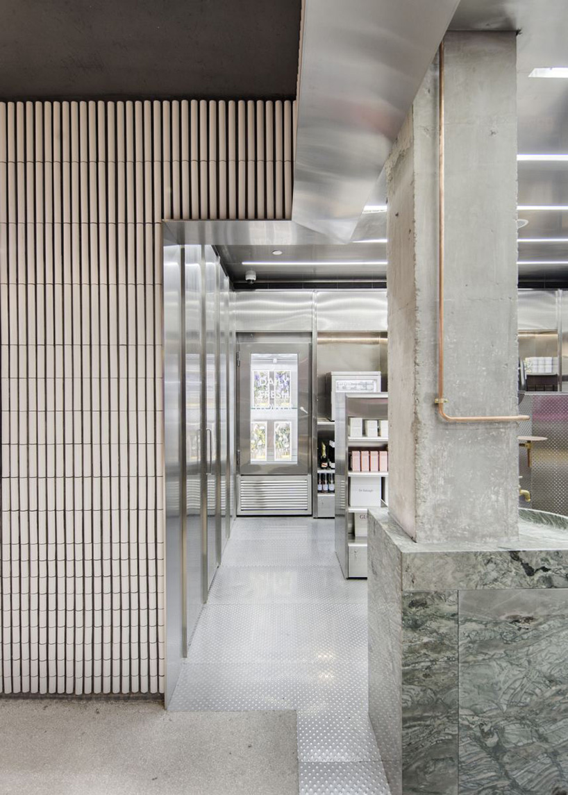 neri & hu incorporates reflective stainless steel and neon in shanghai's little B concept store