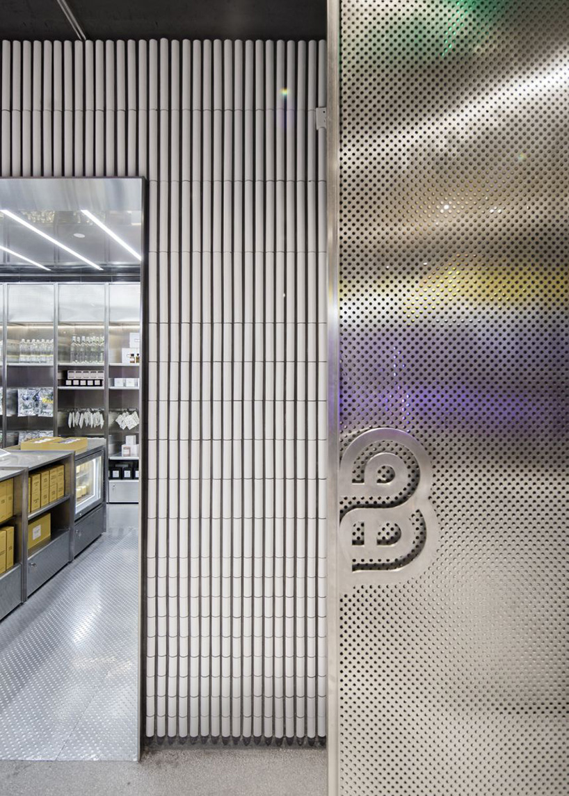 neri & hu incorporates reflective stainless steel and neon in shanghai's little b concept store